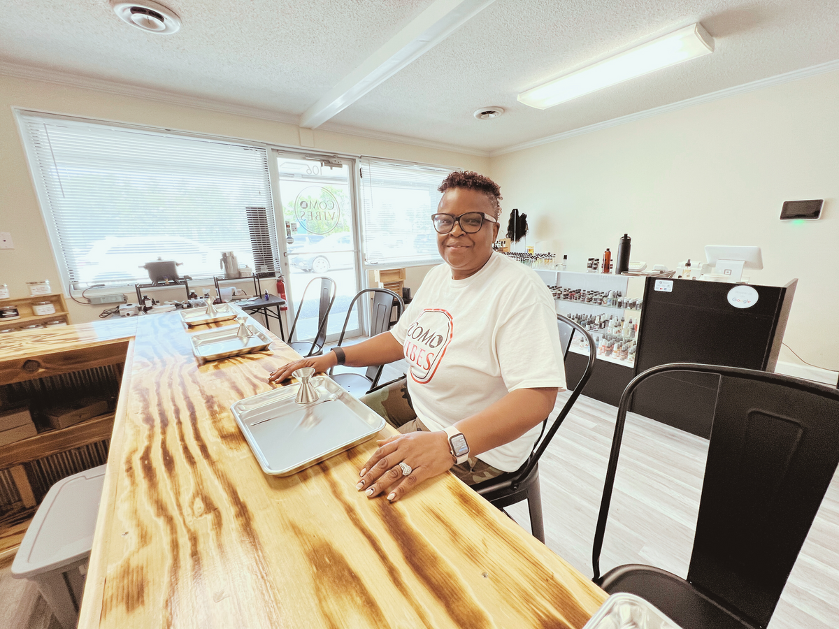 Vivian, owner of CoMo Vibes, at the Columbia candle bar